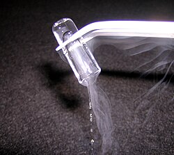A small piece of rapidly melting argon ice shows the transition from solid to liquid.