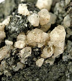 Anorthite crystals in a basalt vug from Vesuvius, Italy (size: 6.9 × 4.1 × 3.8 cm)