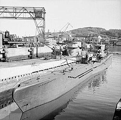 This picture distinguishes the larger Type IX in the background with its double hull and wide upper deck, from the smaller Type VII in the foreground with its saddle tanks.