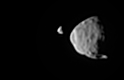 Phobos passing in front of Deimos, as viewed in real time by the Curiosity rover on the surface of Mars.