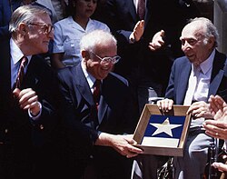 Pasternak (right) receiving his star on Hollywood Boulevard from Johnny Grant with Gene Kelly on the left on July 29, 1991.