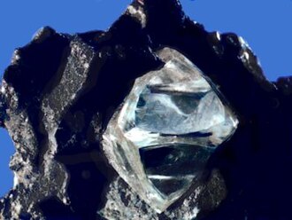 This diamond is a mineral from within an igneous or metamorphic rock that formed at high temperature and pressure