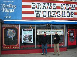 Two members of the Brave New Workshop in front of the former building in Minneapolis.