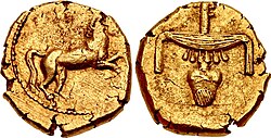 Egyptian gold stater of Nectanebo II: reverse with hieroglyphs nfr-nb, minted in Egypt around 360 BCE.[6]