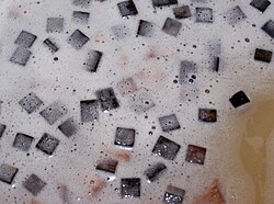 Oak chips in fermenting Chardonnay.