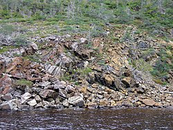 Ophiolite of the Gros Morne National Park, Newfoundland. Ophiolites characteristically have a serpentinite component.