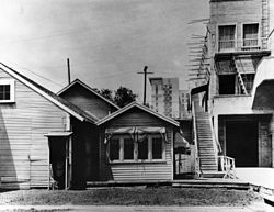Lasky's original studio, a.k.a. "The Barn", in the mid-1920s. The Taft building, built in 1923, is visible in the background.