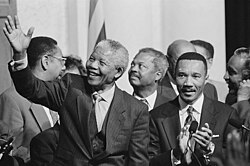 South African president Nelson Mandela with members of the Congressional Black Caucus, including Representative Kweisi Mfume, at an event at the Library of Congress
