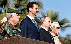 Former Syrian president Bashar al-Assad, Russian president Vladimir Putin, and defence minister Sergei Shoigu at Khmeimim Air Base, December 2017