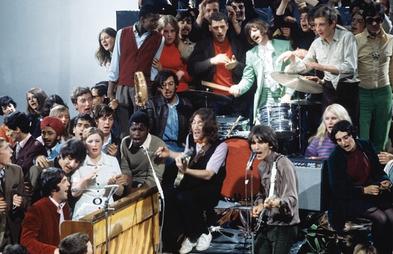 The Beatles performing in the "Hey Jude" promotional film, surrounded by members of the studio audience
