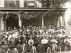 William and Ida McKinley (to her husband's left) pose with members of the "Flower Delegation" from Oil City, Pennsylvania, before the McKinley home. Although women could not vote in most states, they might influence male relatives and were encouraged to visit Canton.