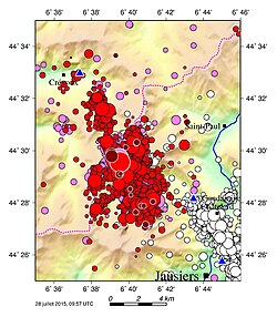 Ubaye earthquake swarmsComplete caption White: 2003–2004 swarm; pink: 2012–2015 swarm up to 2014-04-06; red: earthquakes as of 2014-04-07; pink and red lined up in white: epicentres of 2012-02-26 earthquake (M=4.3) and 2014-04-07 earthquake (M=4.8); brown: latest 20 earthquakes in July 2015, just before the map was drawn. Symbol size directly proportional to magnitude. Blue triangles show the 3 nearest seismic stations.[6]