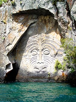 Māori rock carvings at Mine Bay are over 10 metres high and accessible only by boat or kayak.