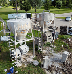 Concrete hoppers to store concrete from concrete mixing transport trucks