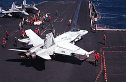 A Marine F/A-18 from VMFA-451 preparing to launch from USS Coral Sea