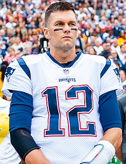 Tom Brady's number 12 was retired by the New England Patriots in 2024, in front of a crowd of 60,000 fans attending his Patriots Hall of Fame induction ceremony