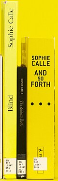 Three books with different titling orientations: ascending (left); descending (middle); upright (right)