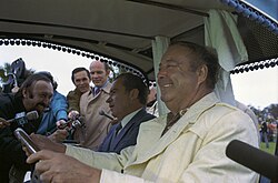 Gleason and President Richard Nixon in a golf cart with an audience in February 1973