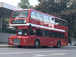 A red Yutong City Master double-decker bus in Skopje