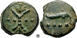 A triens coin (1⁄3 or 4⁄12 of an as). Note the four dots (····) indicating its value.