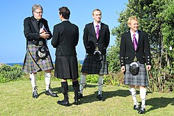 Waiting for the bride. From left: priest, groom and ushers in New Zealand wearing Scottish kilts