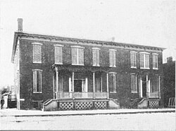 Two houses in Charles Town. The one on the right was the Jefferson County Jail, where John Brown was imprisoned during and after his trial. It has been torn down and is now the site of the Charles Town post office.