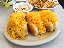 Cheese coneys containing Cincinnati chili, developed in the 1920s by Macedonian immigrants in Cincinnati