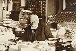 Paul Otlet, working in an office built at his home following the closure of the Palais Mondial, in June 1937