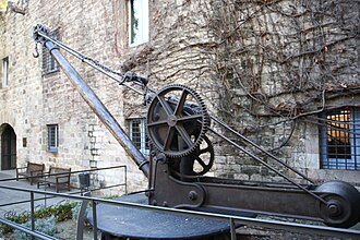 Manual crane from the late 19th century used for unloading small loads from ships at the Port of Barcelona, Spain