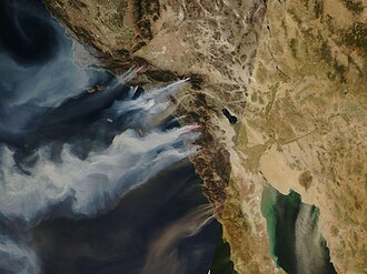 Santa Ana winds in California expand fires and spread smoke over hundreds of miles, as in this October 2007 satellite image.
