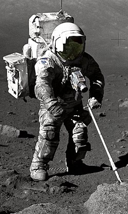 Lunar dust is very fine and difficult to clean off, as with Apollo 17's Harrison Schmitt in a spacesuit working on the Moon being covered in lunar dust