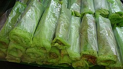 Kuih gulung (also known as kuih ketayap or kuih lenggang)[33][54] are commonly found within Malaysian street stalls wrapped with plastic