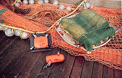 A net mensurations system using acoustic sensors which measure the depth and opening of the trawl net.