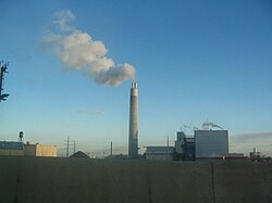 A smokestack releasing smoke
