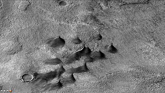 Dunes and dust devil tracks on floor of Huggins Crater, as seen by CTX camera (on Mars Reconnaissance Orbiter). Dark streaks on dunes are dust devil tracks.