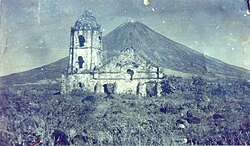 An old photograph of the Cagsawa ruins in February 1, 1814 with the façade still standing. The church was largely destroyed during the 1814 eruption of Mayon. Only the bell tower exists today, the façade having been demolished in the 1960's or 1970's due to structural integrity concerns.