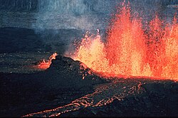 A volcanic fissure and lava channel with lava fountain