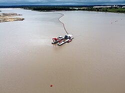 Artificial lake with frac sand dredger