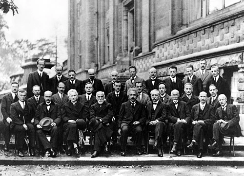 The Solvay Conferences have been devoted to resolving unsolved problems in chemistry and physics since their inception in 1911. The 1927 conference (participants pictured) discussed electrons and photons.