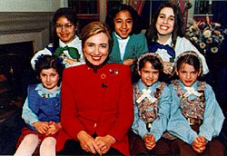 Hillary Clinton posing with Girl Scouts