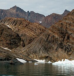 View of the Middle Zone of the Skaergaard layered igneous intrusion, showing the series of plutonic rocks inclined from upper left to lower right