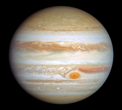 The planet Jupiter, a slight oblate spheroid with a flattening of 0.06487