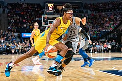 Diamond DeShields (#1) drives to the basket around Maya Moore (#23) in the Minnesota Lynx vs Chicago Sky game