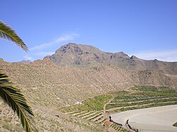 Crest of old tuff ring, including part of the maar crater of a monogenetic volcano, Tenerife, Canary Islands. The maar crater has been used for agriculture.