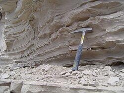 Sediment deposited by the lake with a hammer for scale.