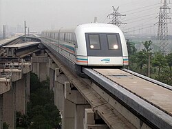 The Transrapid system uses servomechanisms to pull the train up from underneath the track and maintains a constant gap while travelling at high speed