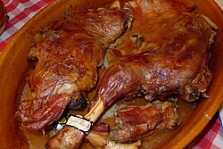 Lechazo asado (roast lechazo), shown above, is a typical dish from Spanish cuisine, as is the similar Cochinillo asado (roast suckling pig).