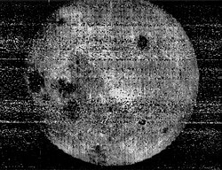 First view of the far side of the Moon, taken by Luna 3, October 7, 1959. Clearly visible is Mare Moscoviense (top right) and a mare triplet of Mare Crisium, Mare Marginis and Mare Smythii (left center).