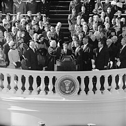 Chief Justice Earl Warren administers the presidential oath of office to Kennedy at the Capitol, January 20, 1961