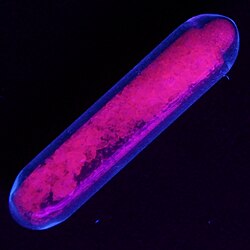 Europium(III) sulfate fluorescing red under ultraviolet light